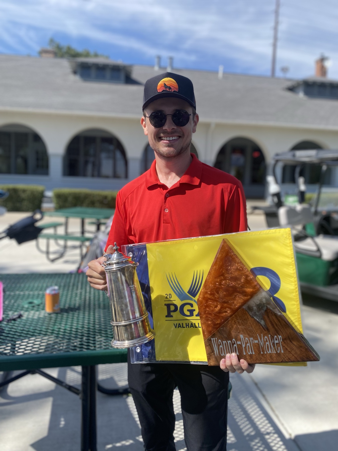 Claret Jug, WPM flag, PGA pin. He came to collect.