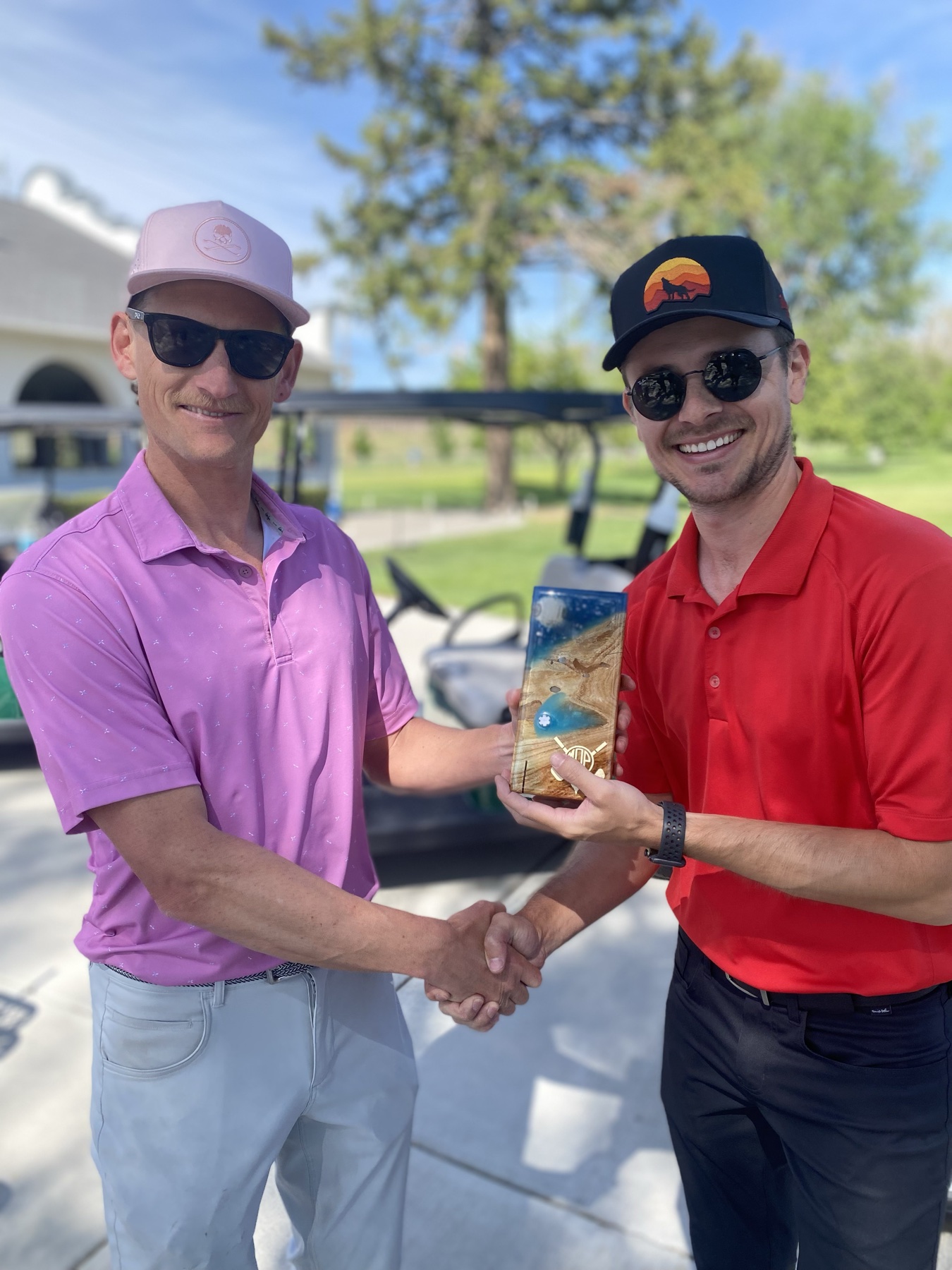 Another trophy, another handshake. They made a lot of trophies.